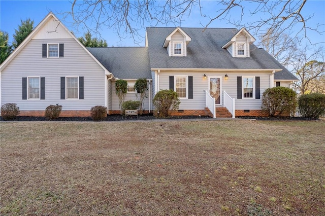 cape cod home featuring a front yard