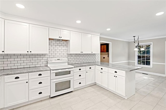 kitchen with double oven range, kitchen peninsula, hanging light fixtures, and white cabinets