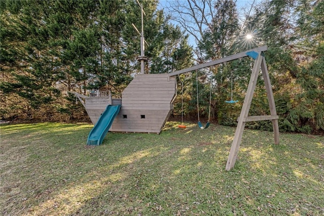 view of playground with a lawn