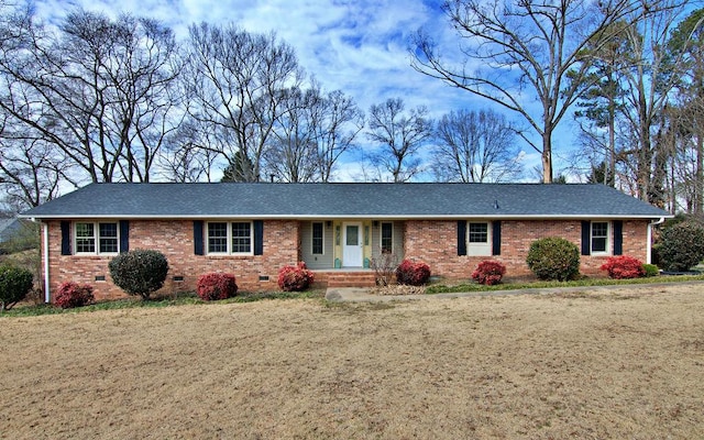 single story home featuring a front yard