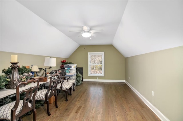 home office featuring lofted ceiling, hardwood / wood-style floors, and ceiling fan