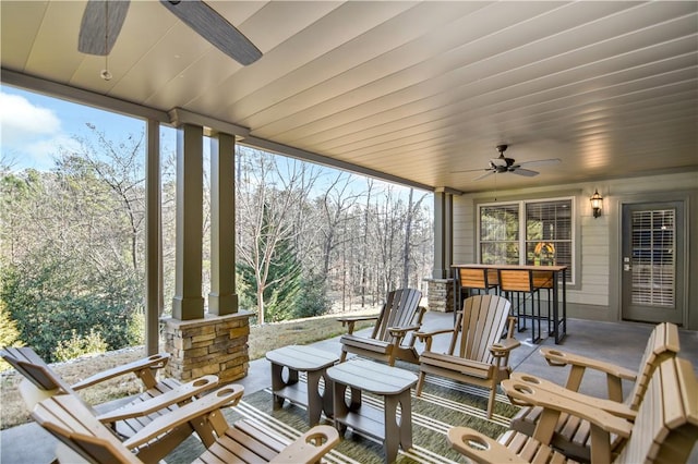 sunroom / solarium with ceiling fan