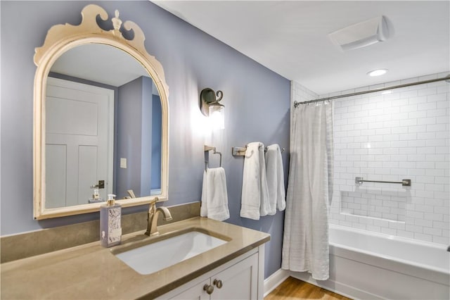 bathroom with vanity and shower / bath combo with shower curtain