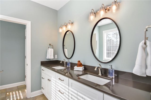 bathroom featuring tile patterned flooring and vanity