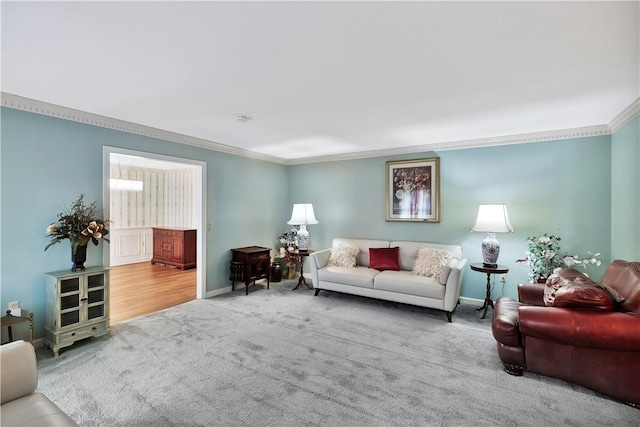 carpeted living room featuring ornamental molding