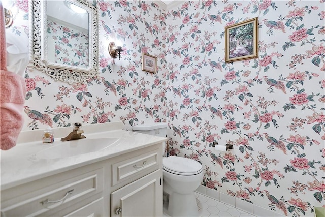 bathroom with vanity, tile patterned floors, and toilet