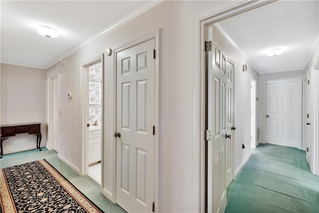 corridor featuring ornamental molding and light carpet