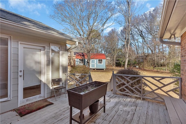 wooden deck with a storage shed