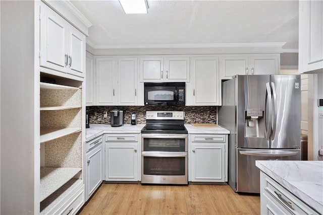 kitchen with backsplash, appliances with stainless steel finishes, light hardwood / wood-style flooring, and white cabinets