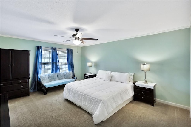 carpeted bedroom with crown molding and ceiling fan