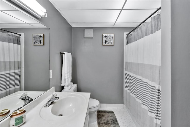 bathroom with walk in shower, toilet, and sink