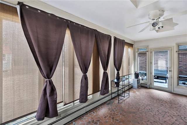 interior space with ceiling fan and a baseboard radiator