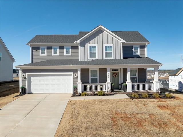 view of front of house with a porch and a garage