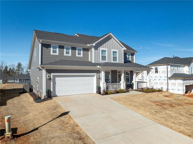 view of front of property featuring a porch and a garage