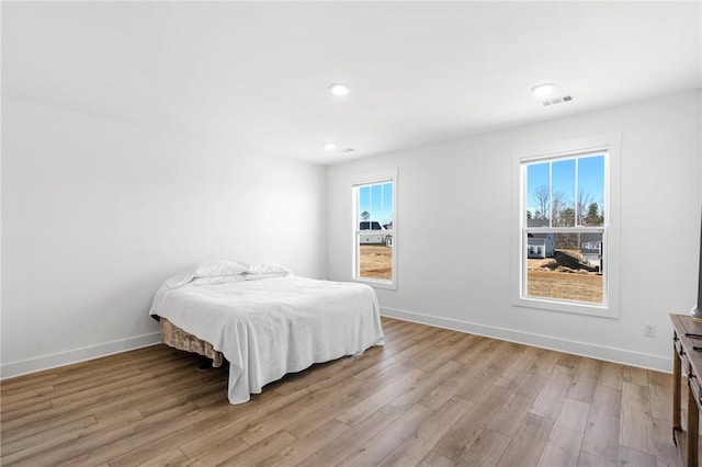 bedroom with light hardwood / wood-style flooring