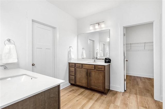 bathroom featuring vanity and hardwood / wood-style floors