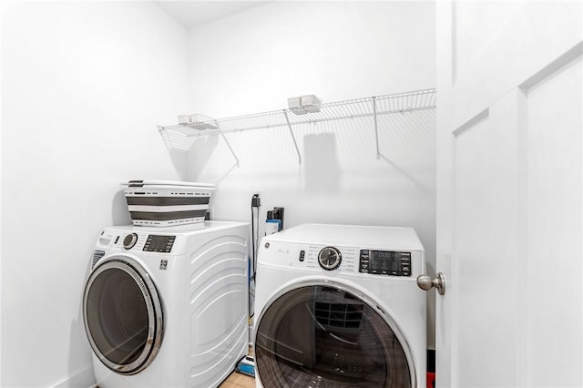 laundry room with washer and dryer