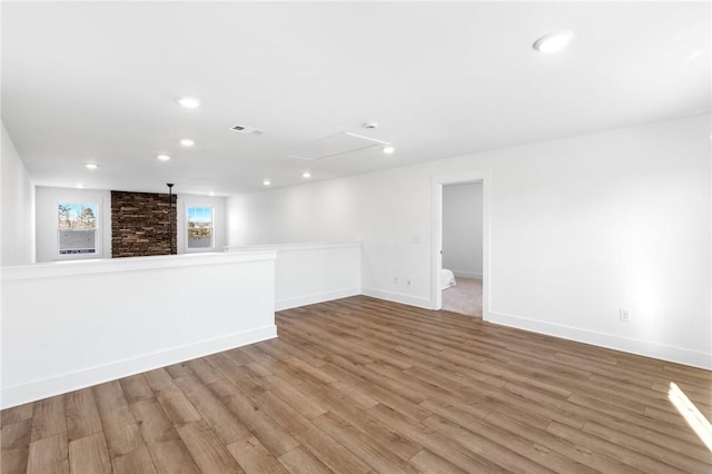 spare room featuring light wood-type flooring