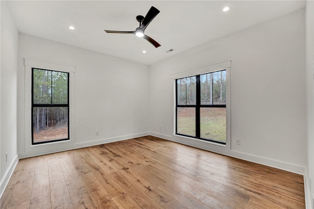 unfurnished room with light hardwood / wood-style floors and ceiling fan