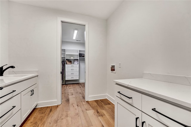 bathroom with wood-type flooring and vanity