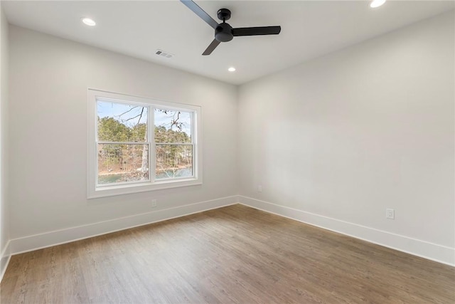 unfurnished room featuring ceiling fan and wood-type flooring