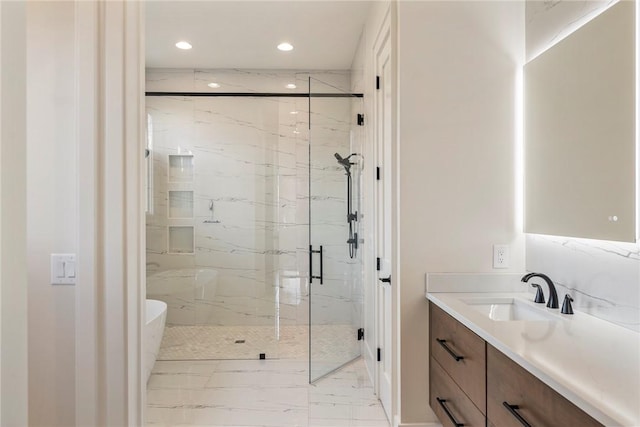 bathroom with vanity and a shower with door