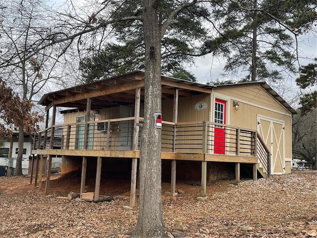 back of house featuring a deck