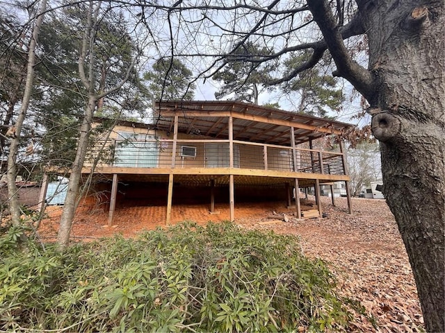 rear view of property with a wooden deck