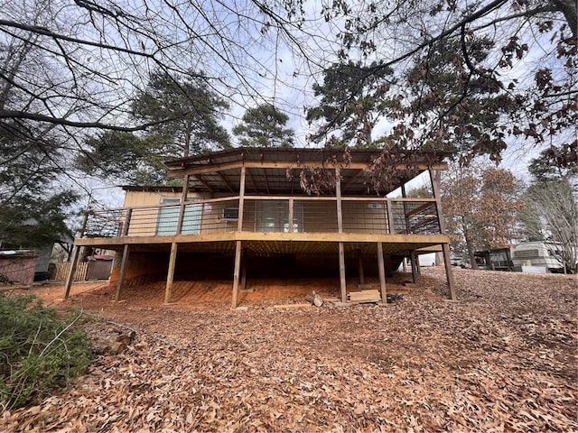 back of property featuring a deck