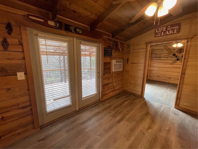 doorway featuring vaulted ceiling with beams, wood ceiling, a wall mounted AC, wooden walls, and hardwood / wood-style flooring