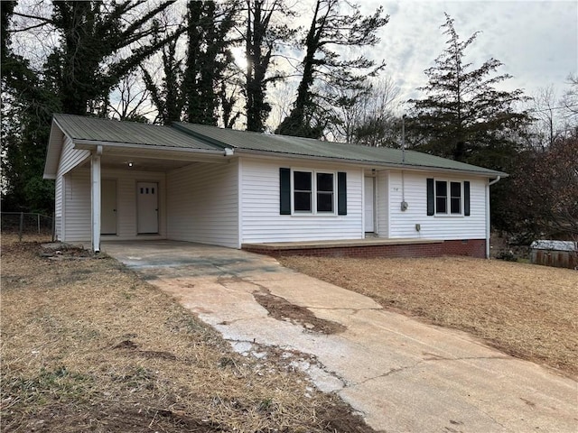 ranch-style home with a carport