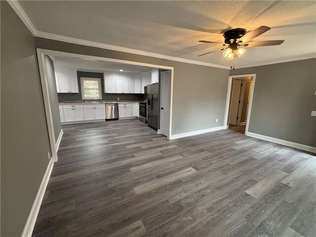 unfurnished living room featuring ornamental molding and dark hardwood / wood-style floors