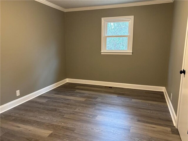 unfurnished room with dark wood-type flooring and ornamental molding