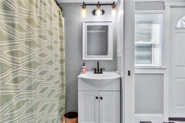 bathroom with vanity and a wealth of natural light