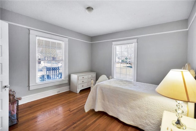 bedroom featuring dark wood-type flooring