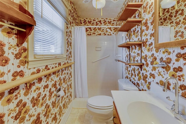 bathroom featuring vanity, toilet, curtained shower, and tile patterned flooring