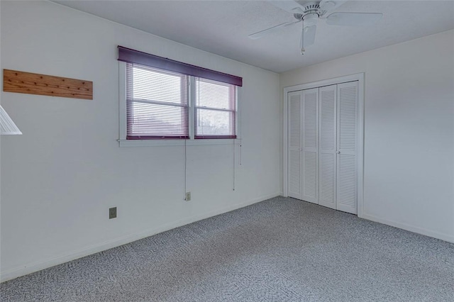 unfurnished bedroom featuring a closet, ceiling fan, and carpet flooring