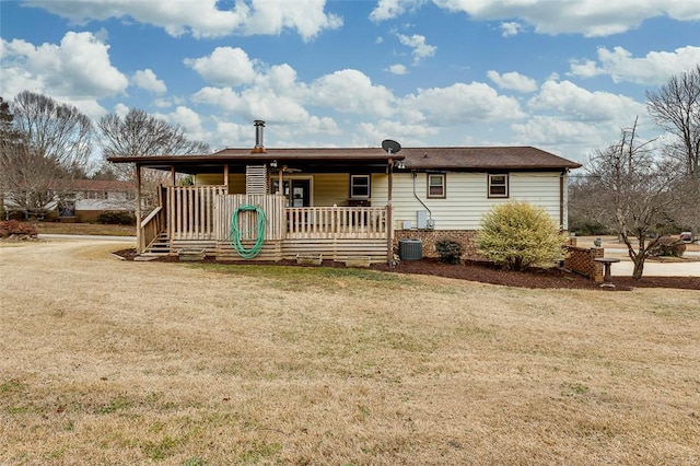 view of front of home featuring covered porch, a front yard, and central air condition unit