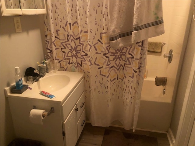 bathroom featuring vanity and shower / bath combo with shower curtain