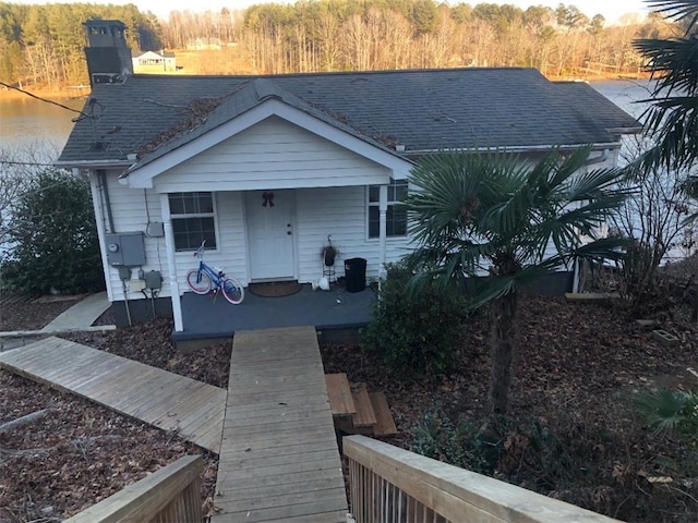 back of house featuring a water view