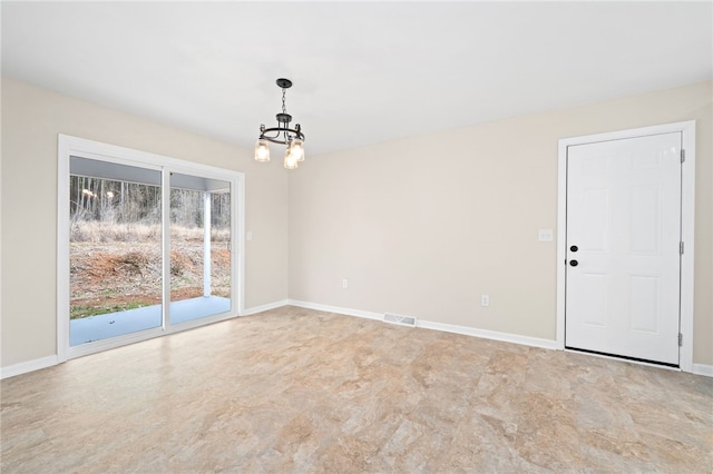 unfurnished dining area featuring a notable chandelier