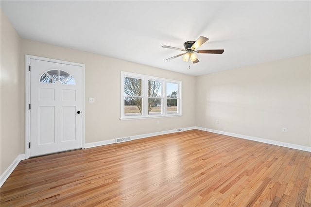 foyer entrance featuring ceiling fan and light wood-type flooring