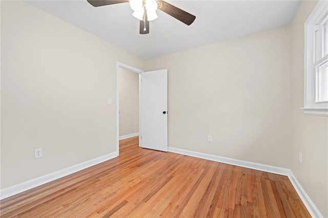 unfurnished room with ceiling fan and light hardwood / wood-style flooring