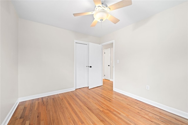 spare room featuring ceiling fan and light hardwood / wood-style flooring