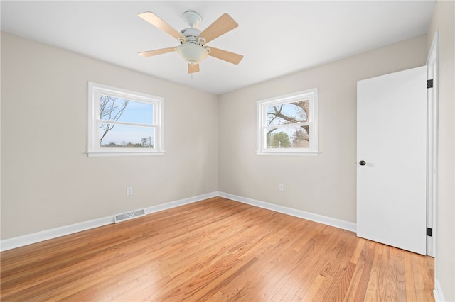 empty room featuring ceiling fan and light wood-type flooring