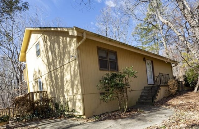 view of side of home featuring crawl space