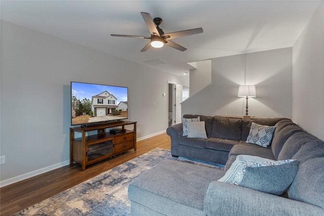 living room with dark wood-type flooring and ceiling fan