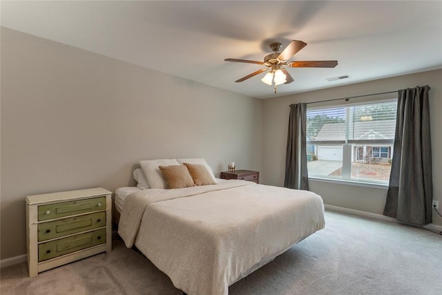 bedroom featuring ceiling fan and light colored carpet