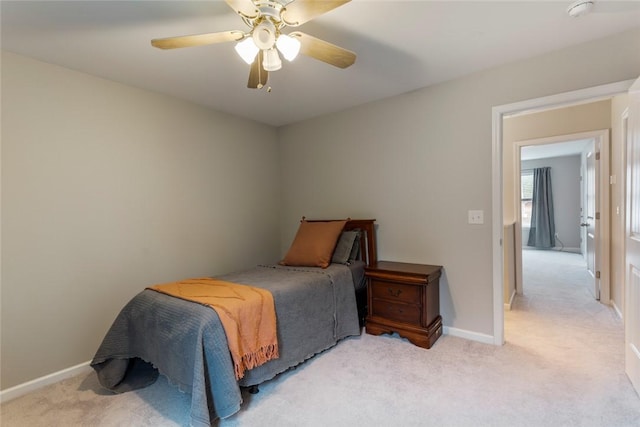 bedroom with light colored carpet and ceiling fan