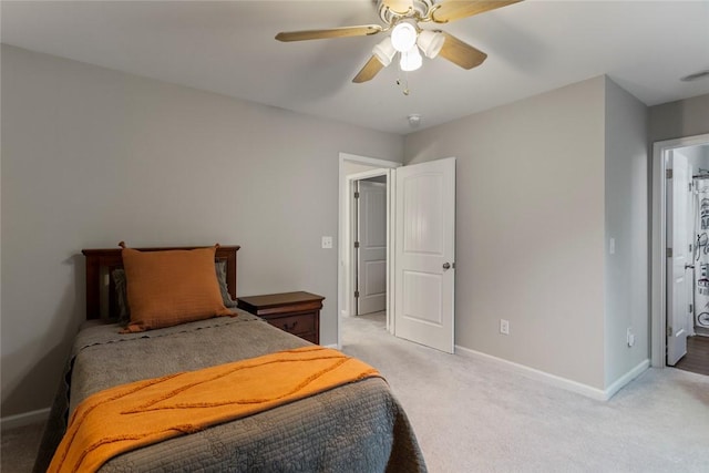 bedroom featuring light carpet and ceiling fan